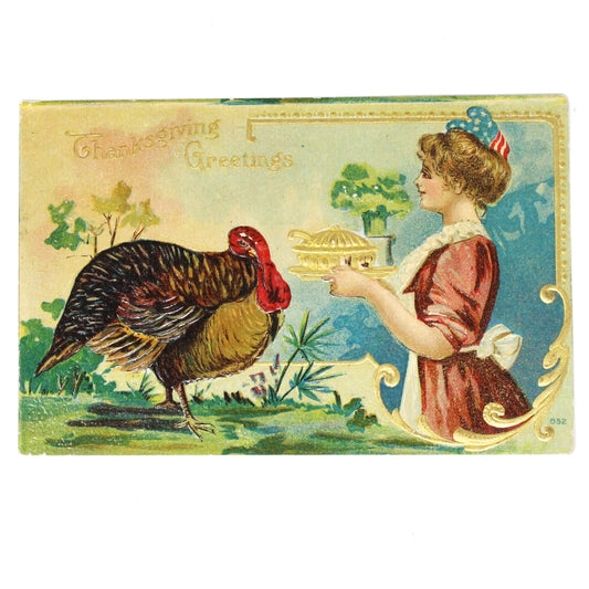 Antique embossed and gilded Thanksgiving postcard featuring an illustration of a turkey and a woman in a patriotic hat holding a dish with 'Thanksgiving Greetings' text.