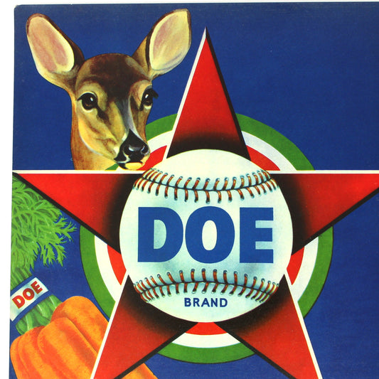 A vintage-style DOE Brand carrots crate label front shown upright. The design features a blue field, a deer head, orange carrots, a baseball with the DOE logo, and a large red star.