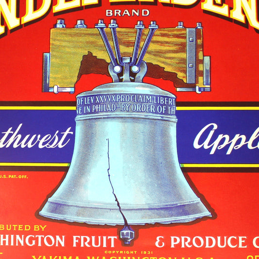 A vintage red fruit crate label for Independent Brand Northwest Apples, featuring a large silver bell illustration and text including 'Washington Fruit & Produce Co.' and 'Yakima, Washington U.