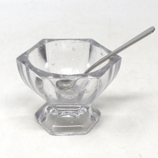 A vintage master salt cellar / salt dip, made of molded blown glass with visible bubbles, with spoon.