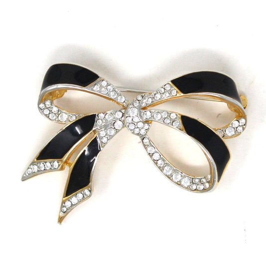 Vintage Brooch, Bow-shaped with black enamel and white rhinestones on gold .