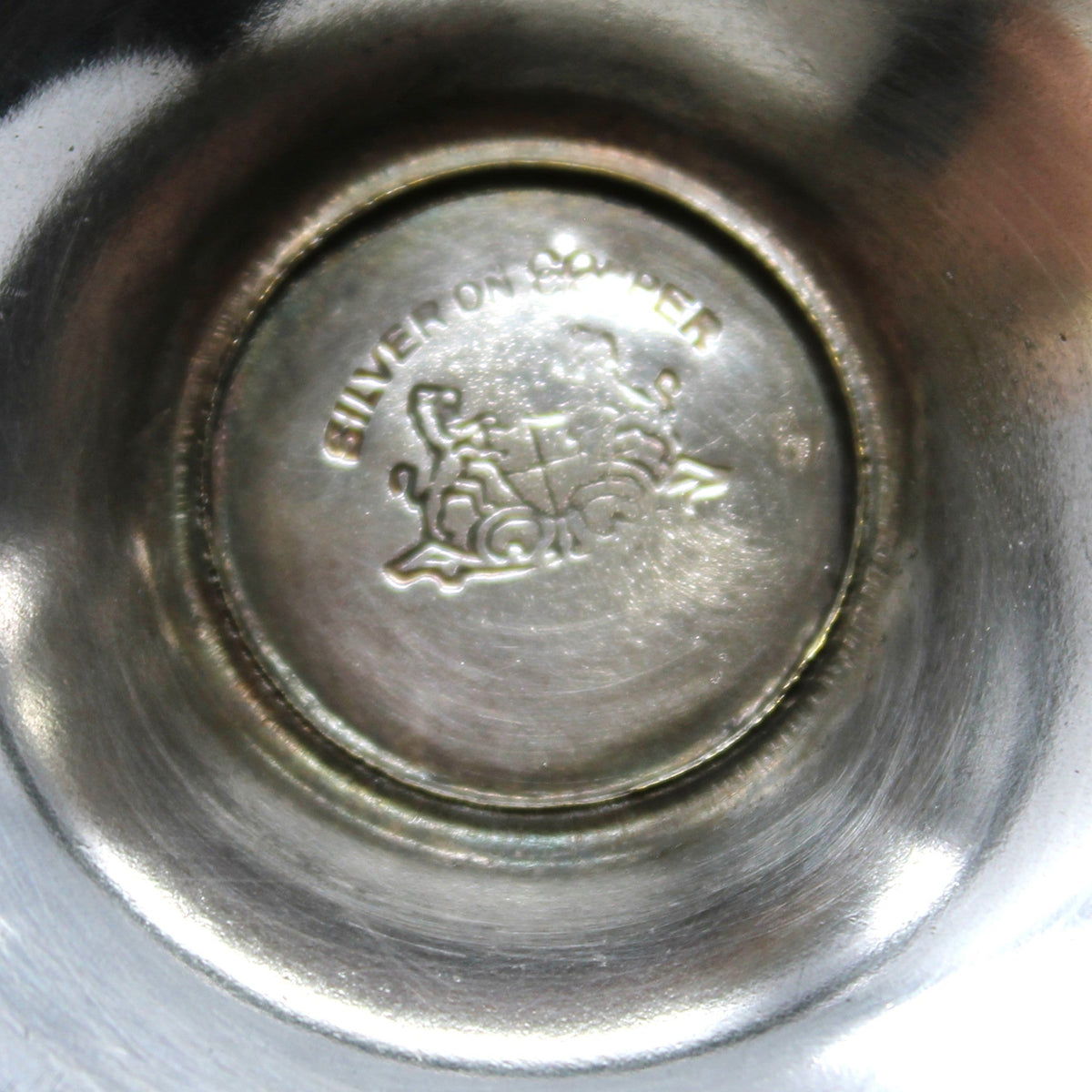 close up of Lehman Brothers logo on silverplate sugar bowl