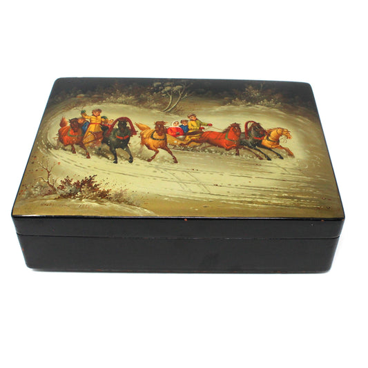 Vintage wooden lacquer box with hand-painted Fedoskino Troika sled racing image on the lid, artist signed, black lacquer box with red interior.