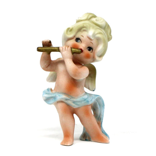 Vintage Ceramic figurine of a cherub playing a flute with a blue sash. Bisque porcelain.