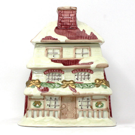 Vintage ceramic cookie jar shaped like a Victorian House decorated for Christmas. Cookie jar collector gifts.
