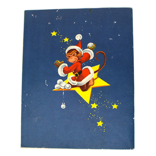 back cover of a vintage Christmas children's book, featuring a cartoon monkey dressed as Santa Claus riding a yellow star, set against a dark blue background with small yellow stars.