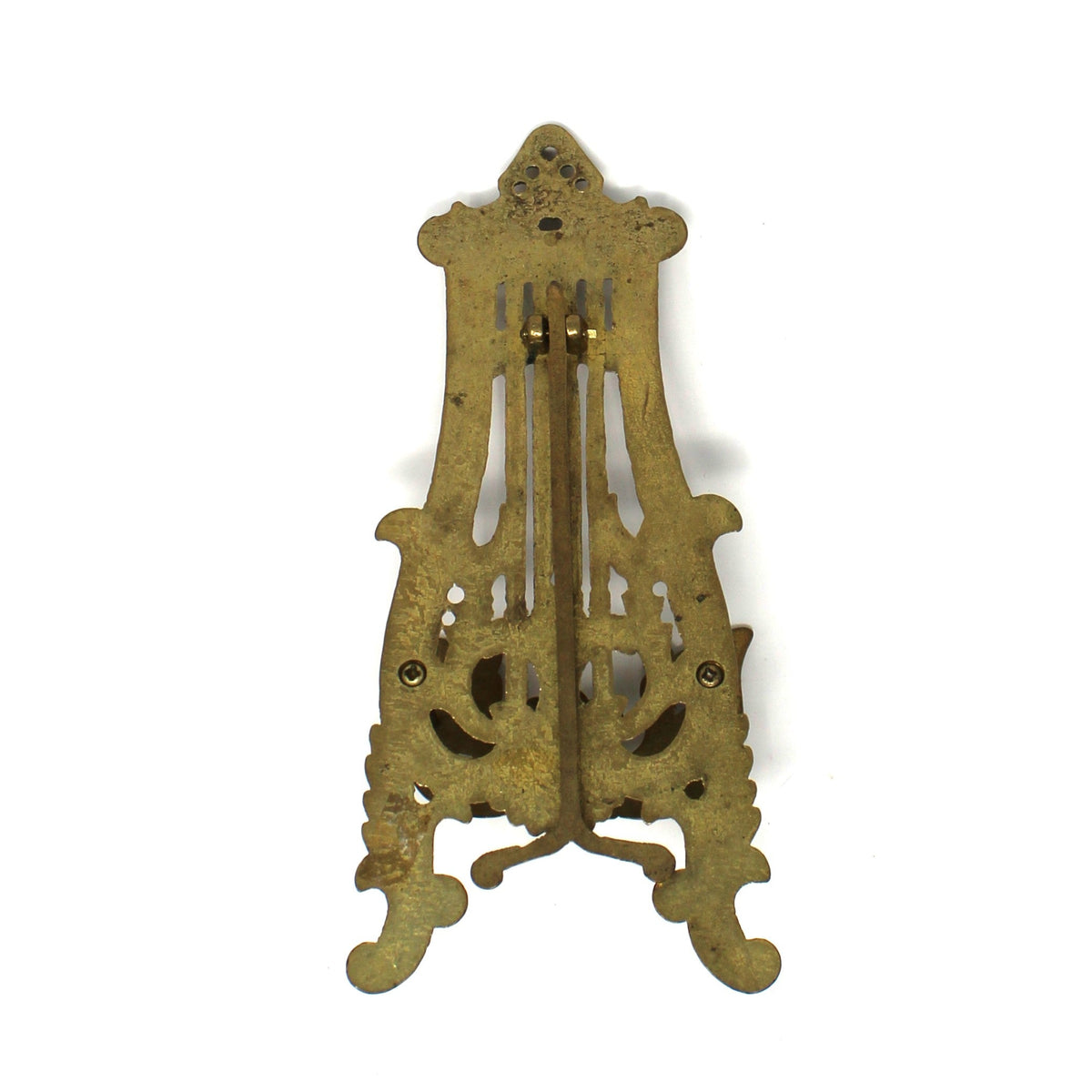 Back view of an ornate brass easel, display stand. Shown closed from the back.