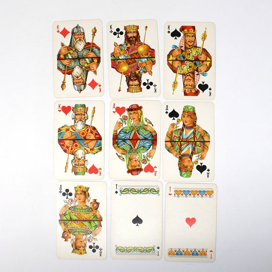View of Nine playing cards from 1976 Russian card game, including three Kings, Queens and Ace cards, arranged in a 3x3 grid.