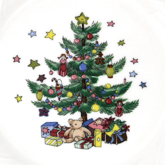 Close up of design on Nikko Happy Holidays Salad Plates with decorated Christmas tree, teddy bear and gift boxes.