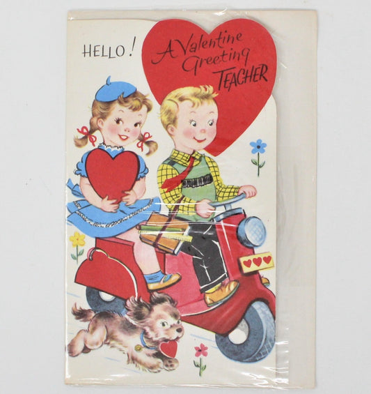 Vintage Valentine's Day greeting card featuring an illustration of a boy and girl on a red scooter with a dog, accompanied by a heartfelt message.