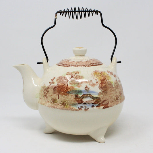 Antique Brown & Richie teapot with Oriental Gardens transferware pattern, featuring a wire handle and three little feet