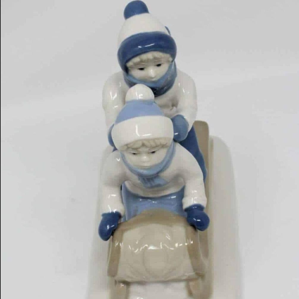 Figurine, Boy & Girl On Sled, Porcelana de Cuernavaca, Mexico, Vintage