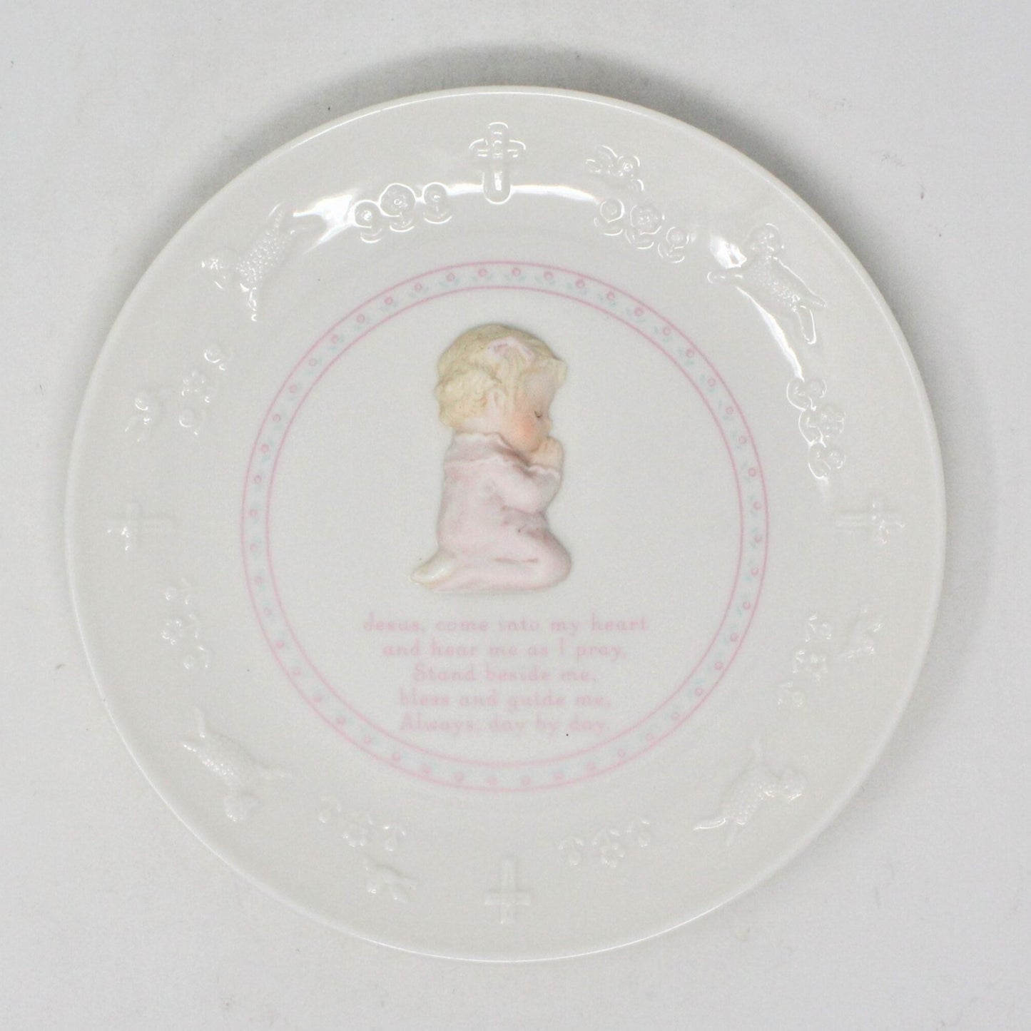 Decorative plate with a silhouette of a child and text on a white background