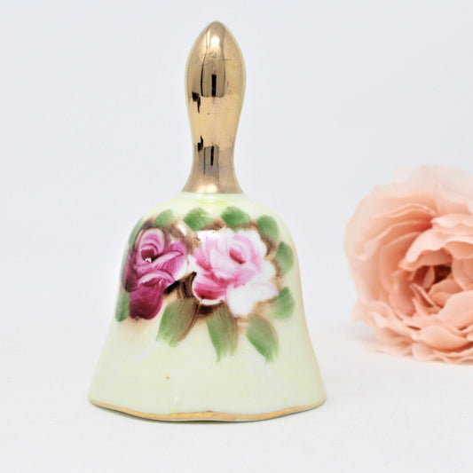 vintage porcelain bell, Enesco collectible.  Hand painted pink roses and gold handle.