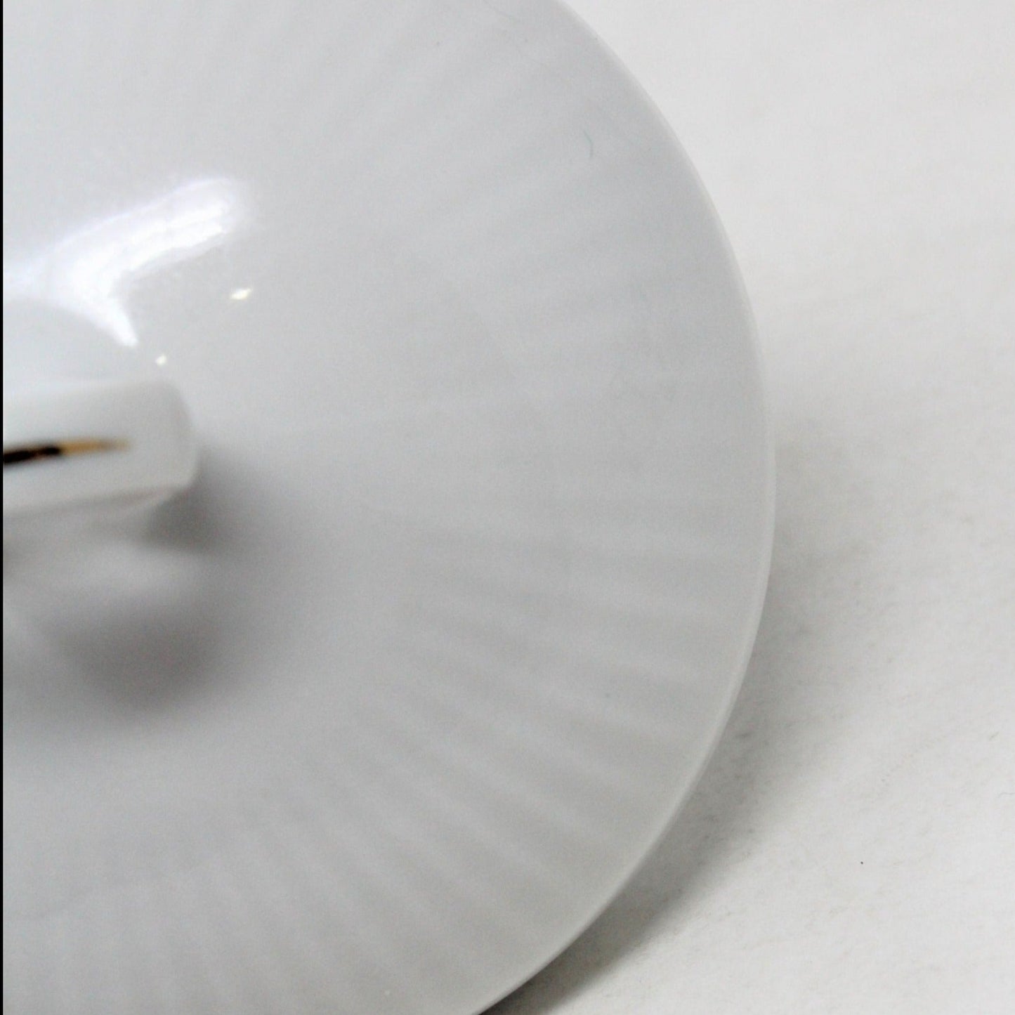 Detail view of ridges on porcelain sugar bowl lid