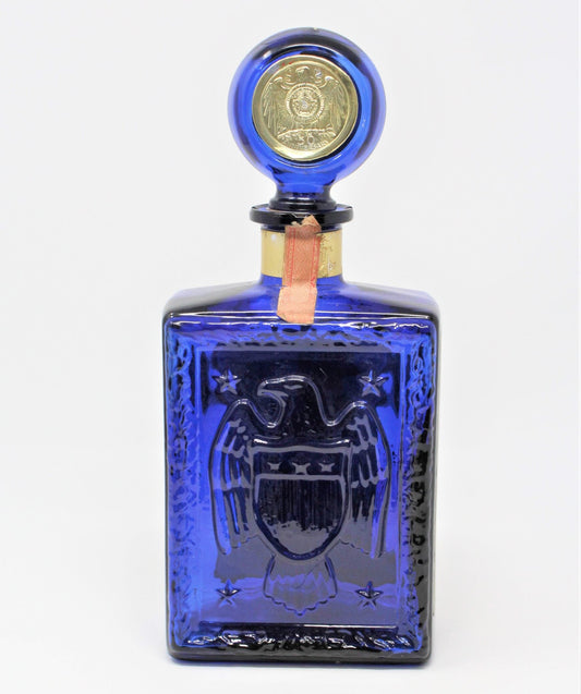 Back side of Vintage Decanter, 1969 JW Dant, American Legion 50th Anniversary, with original seal. Cobalt Blue Glass, Embossed American Eagle