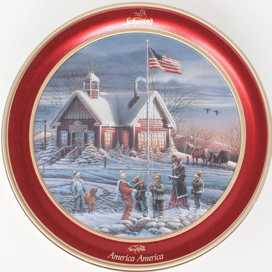 A round collectible tin with a painting of a snowy winter scene featuring a small school house, a teacher, and children. The tin has a red and gold color scheme with the 'Schwan's America America' text and flag motifs.