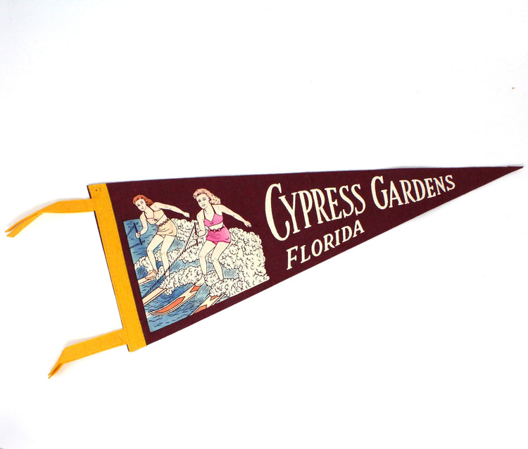 Vintage felt pennant souvenir from Cypress Gardens, Florida.  Featuring an illustration of two female water skiers Burgundy red wool felt