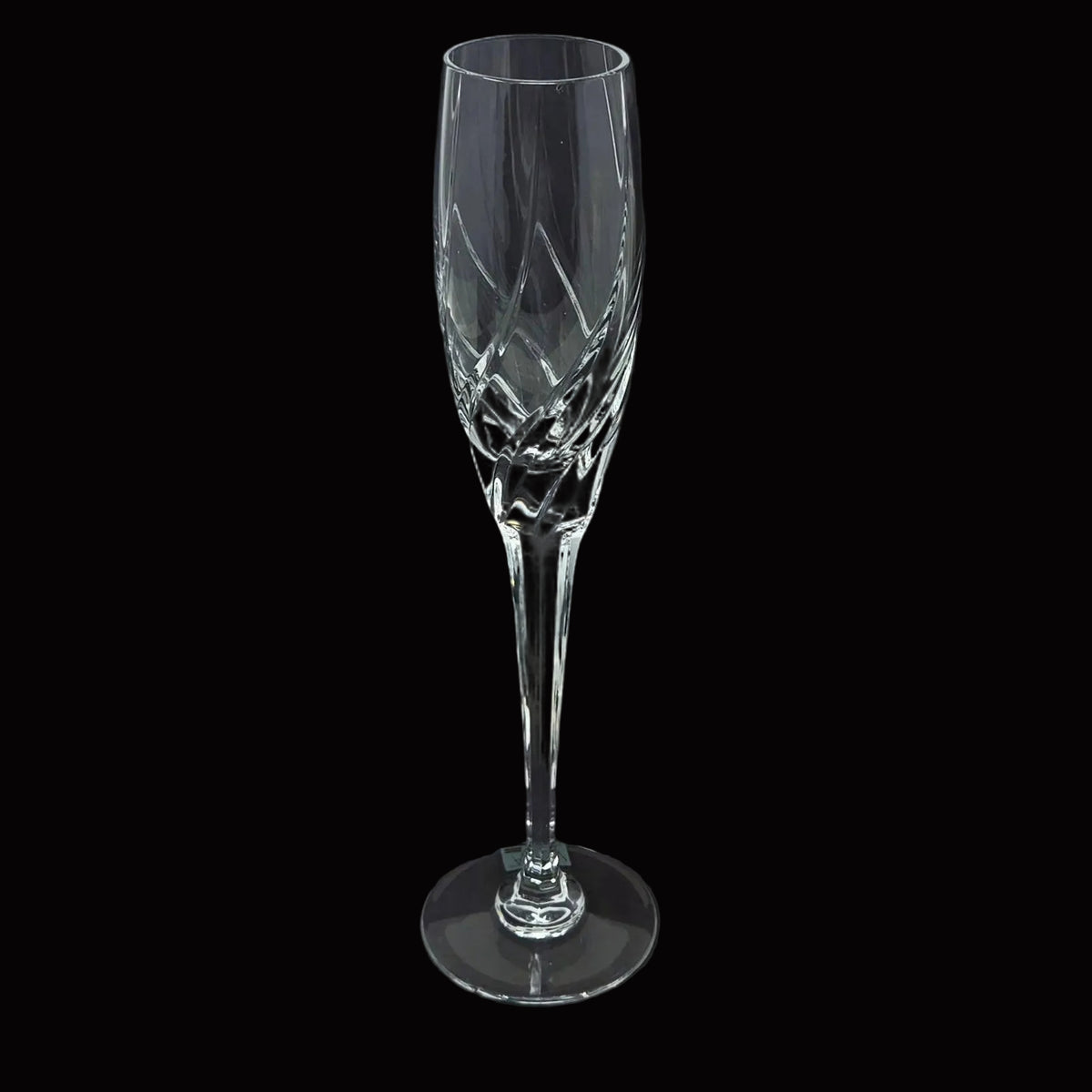 A clear cut-crystal champagne flute from Mikasa in their Olympus pattern.