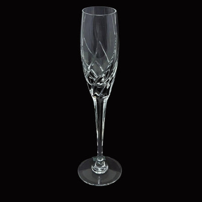 A clear cut-crystal champagne flute from Mikasa in their Olympus pattern.