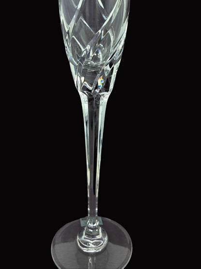 Up close view of the stem on a  clear cut-crystal champagne flute from Mikasa in their Olympus pattern.  
