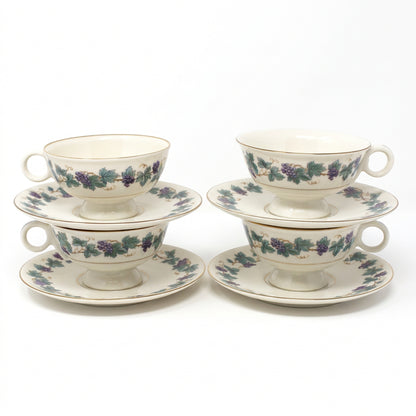 Vintage set of four Tea Cups & Saucers from Theodore Haviland, in the Arbor pattern with grape clusters and leaves. 
