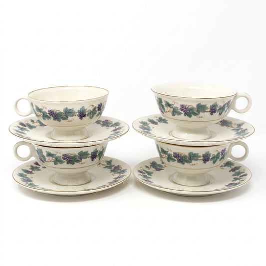 Vintage set of four Tea Cups & Saucers from Theodore Haviland, in the Arbor pattern with grape clusters and leaves. 