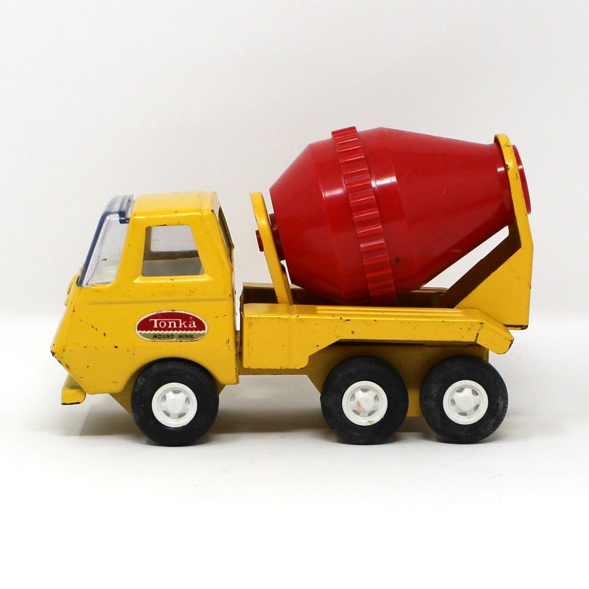 Side view of vintage collectible Tiny Tonka Toy Cement Mixer Truck, Pressed Steel, Yellow / Red, 1970s