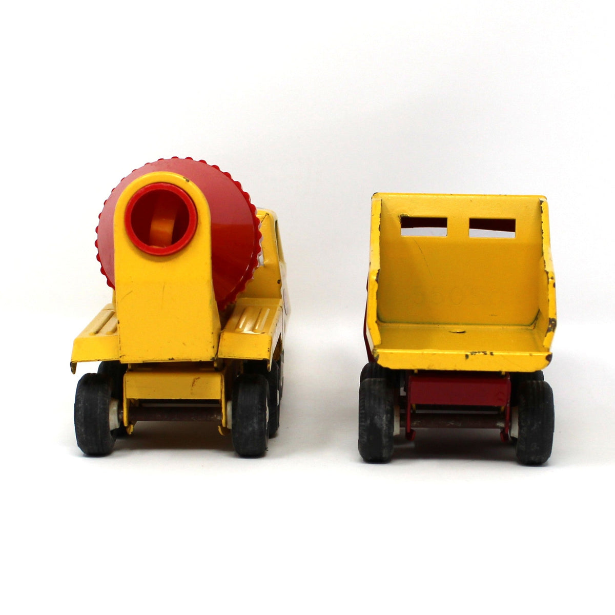 Back view of pair of vintage collectible Tonka Toy Trucks: Cement Mixer & Dump Truck, Pressed Steel, Yellow / Red, 1970s