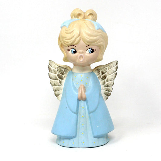 A vintage ceramic figurine of a choir angel singing, with blue and white color scheme, hand-painted, with gold accents on wings and a blue hair ribbon.  Mid Century