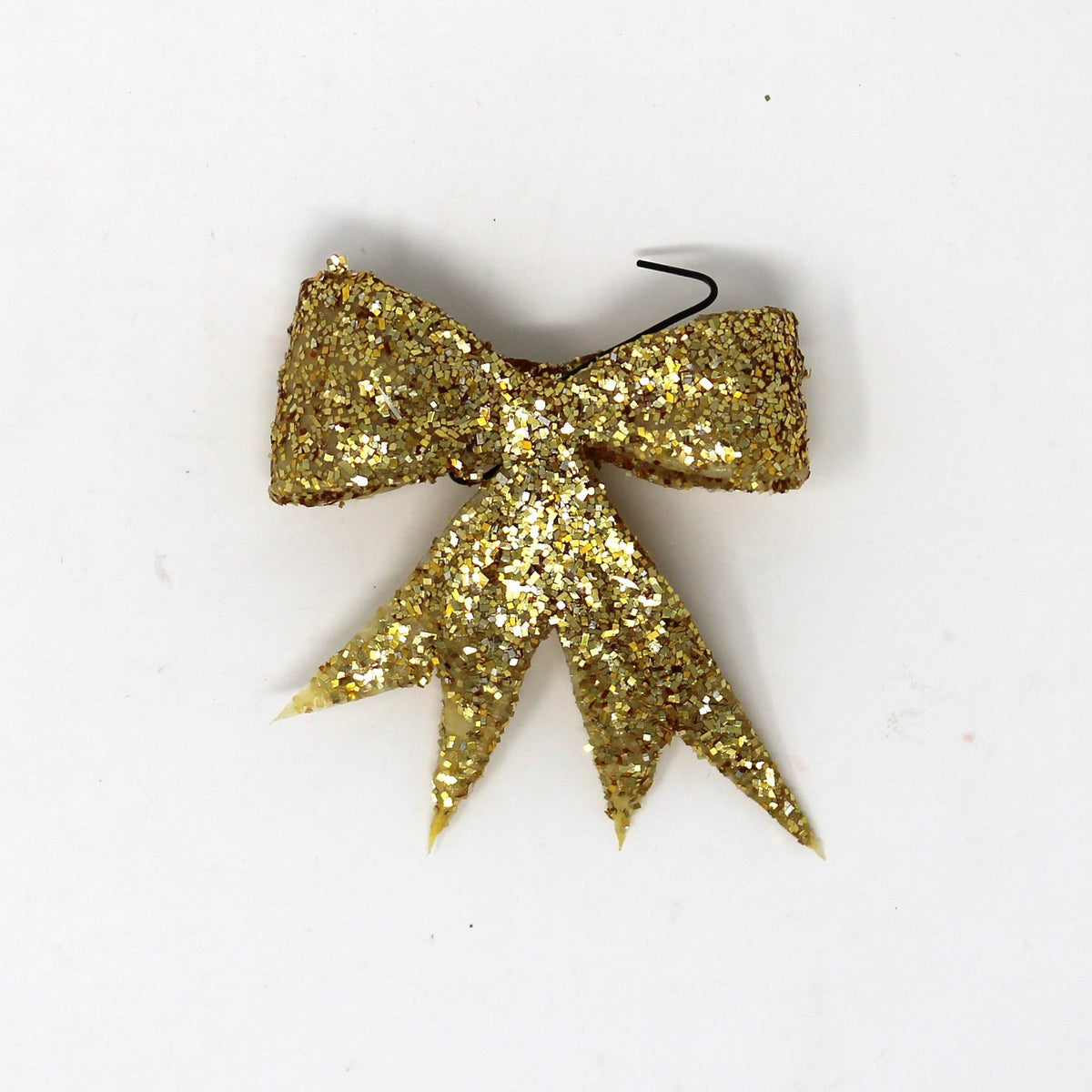 vintage celluloid bow shaped Christmas ornaments, covered in gold glitter. 