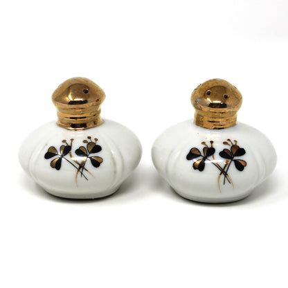 Salt and Pepper Shakers: Ucagco, Round Porcelain Gold Tops, Black / Gold Clovers, Vintage Japan, 1940s