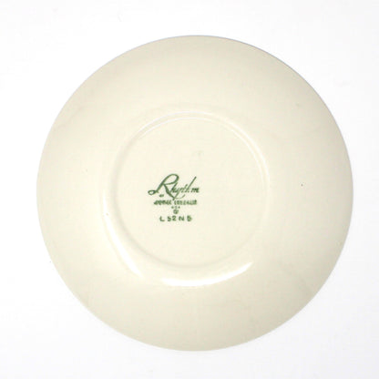 Back view of vintage Homer Laughling ceramic plate with a logo 