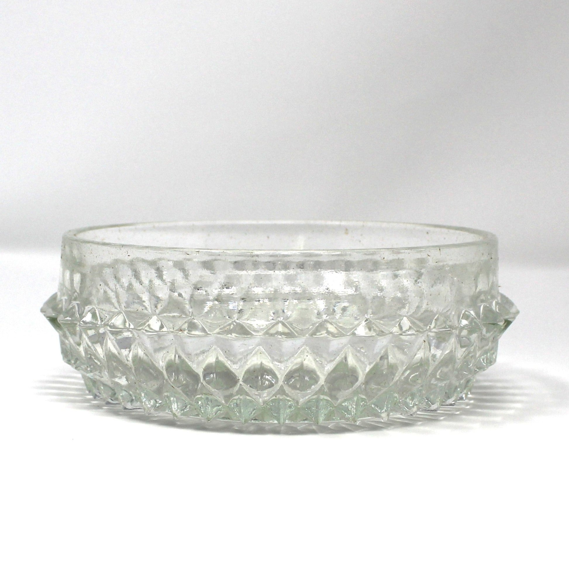 Clear glass bowl with textured Diamond Point pattern.