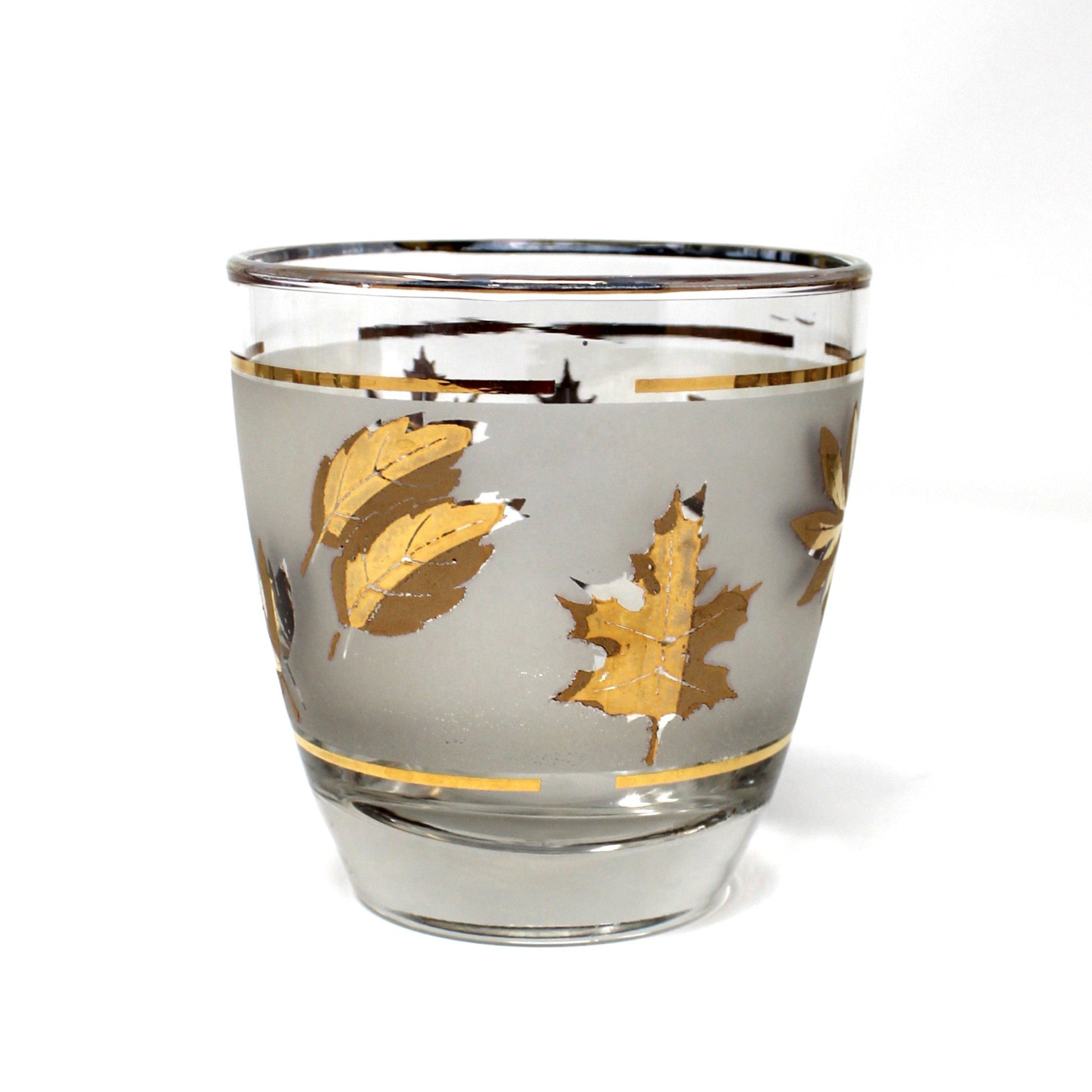 Clear glass with gold leaf design on a white background