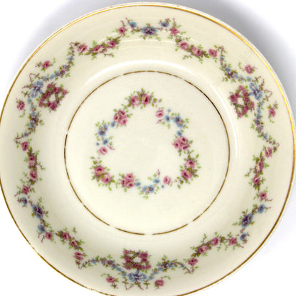 Decorative ceramic plate with floral pattern on a beige background