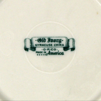 Ceramic small bowl with a visible brand logo, Old Ivory, on a beige background