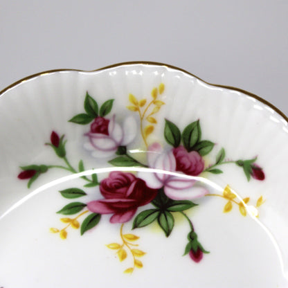 Decorative ceramic plate with floral design on a gray background
