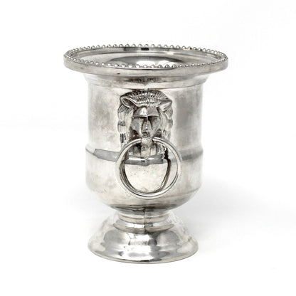 Silver candle holder with decorative ring on a white background