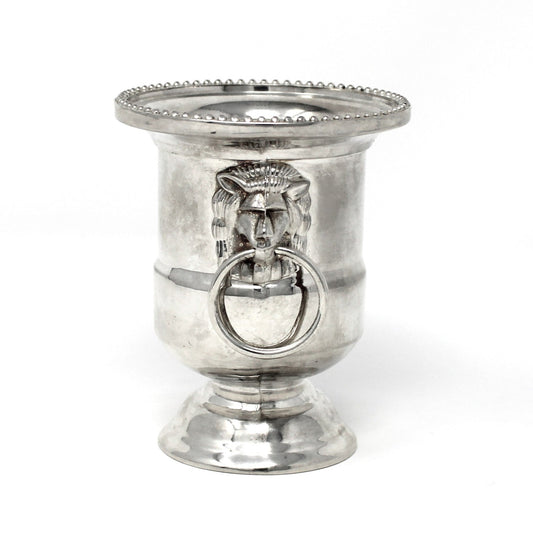 Silver candle holder with decorative ring on a white background