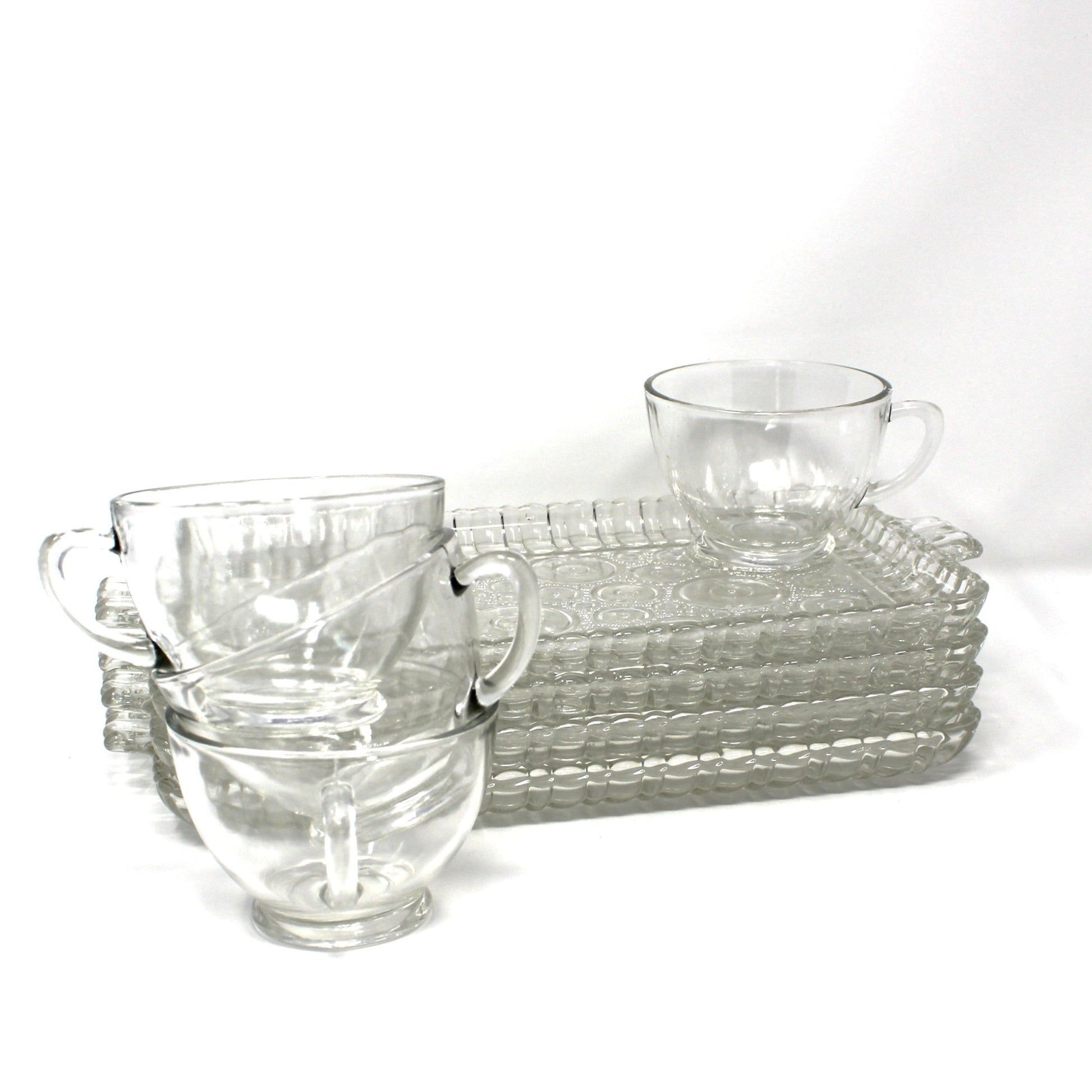 Set of 4 Serva-Snack sets.  Clear glass plates and cups in Colonial Lady pattern.  