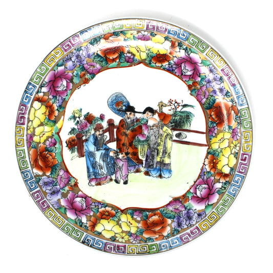 Decorative plate, Rose Mandarin Famille Rose.  Colorful floral border and central scene of Asian people in traditional attire.