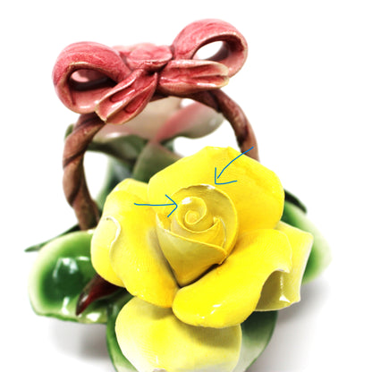 Close up view of yellow ceramic rose on Capodimonte floral basket.  