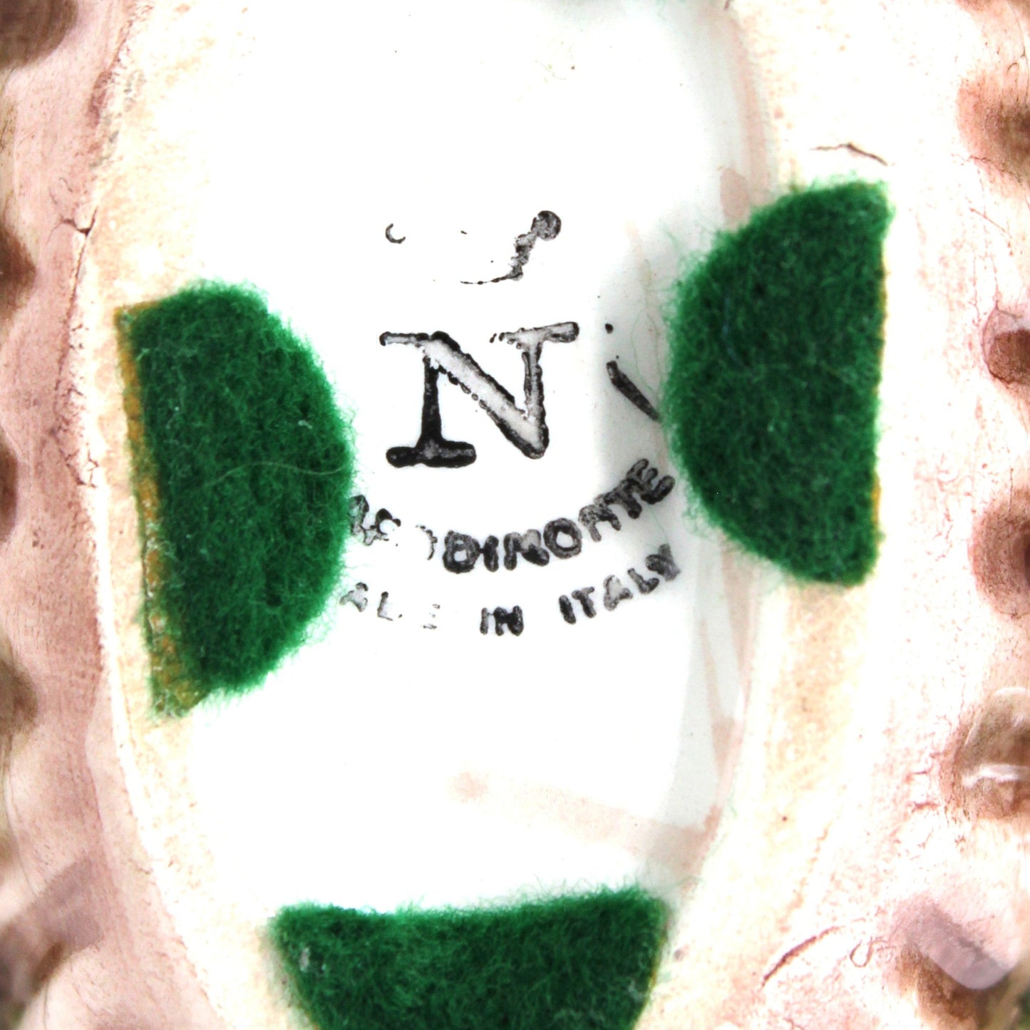 Close up view of Capodimonte backstamp with Crown and N, Made in Italy.