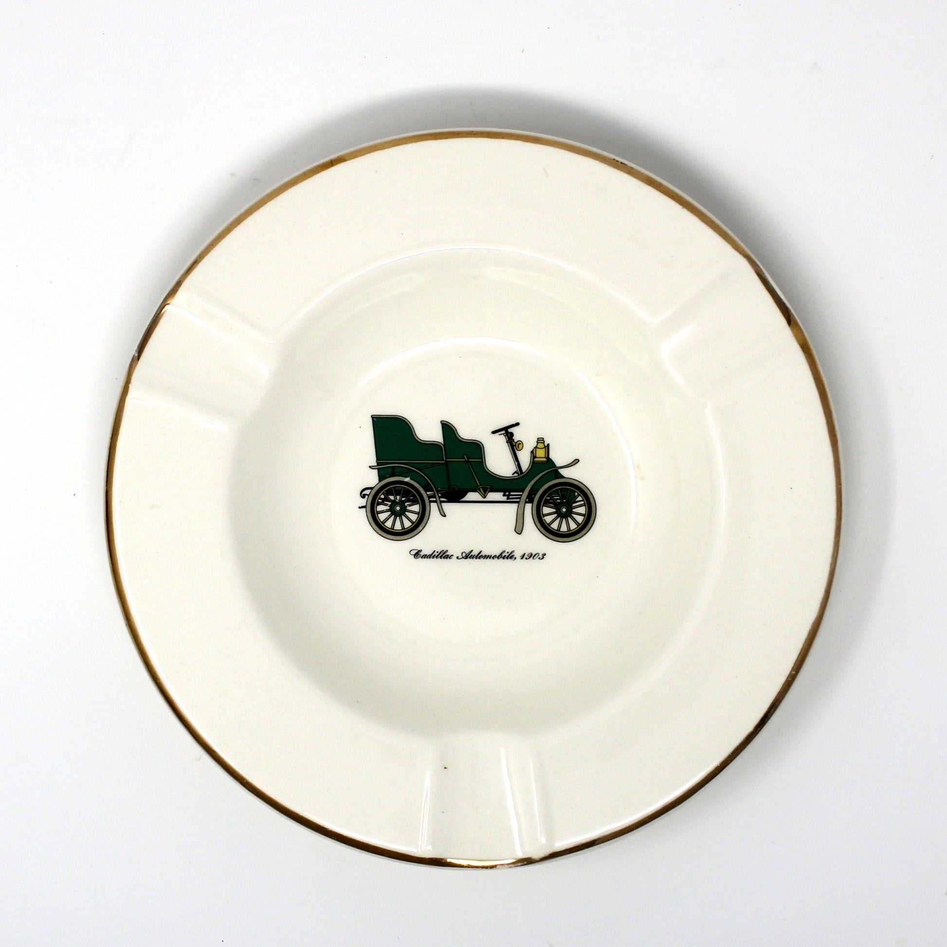 Vintage advertising ashtray with antique car design. Promotional item for Warren Cadillac Inc.