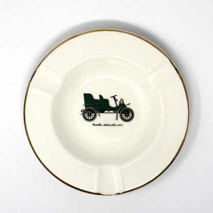 Vintage advertising ashtray with antique car design. Promotional item for Warren Cadillac Inc.