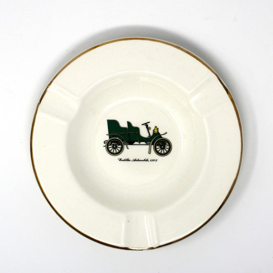 Vintage advertising ashtray with antique car design. Promotional item for Warren Cadillac Inc.