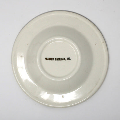 Back view of vintage advertising ashtray for Warren Cadillac Inc.