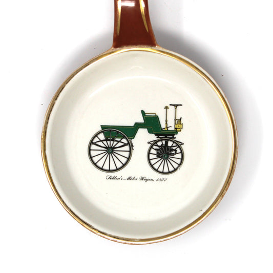 Close up of decal on Gladding McBean dish, featuring an old-fashioned carriage: Selden's Motor Wagon 1877.