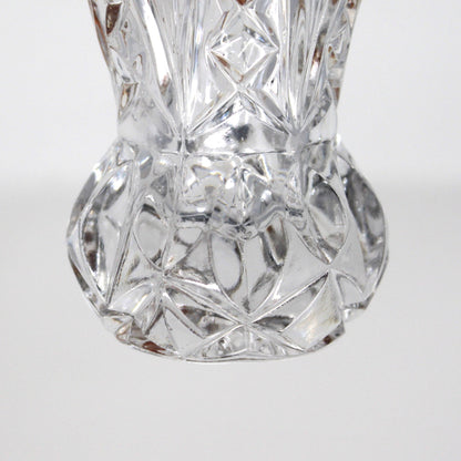 Close up view of bulbous base on vintage, intricately cut crystal, toothpick holder.  